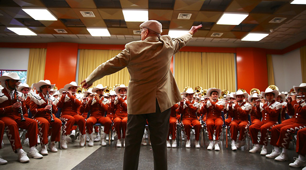 Director Emeritus Vincent DiNino guest conducts the Longhorn Band
