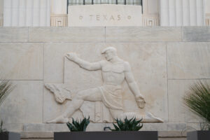 Exterior frieze of man with state of Texas