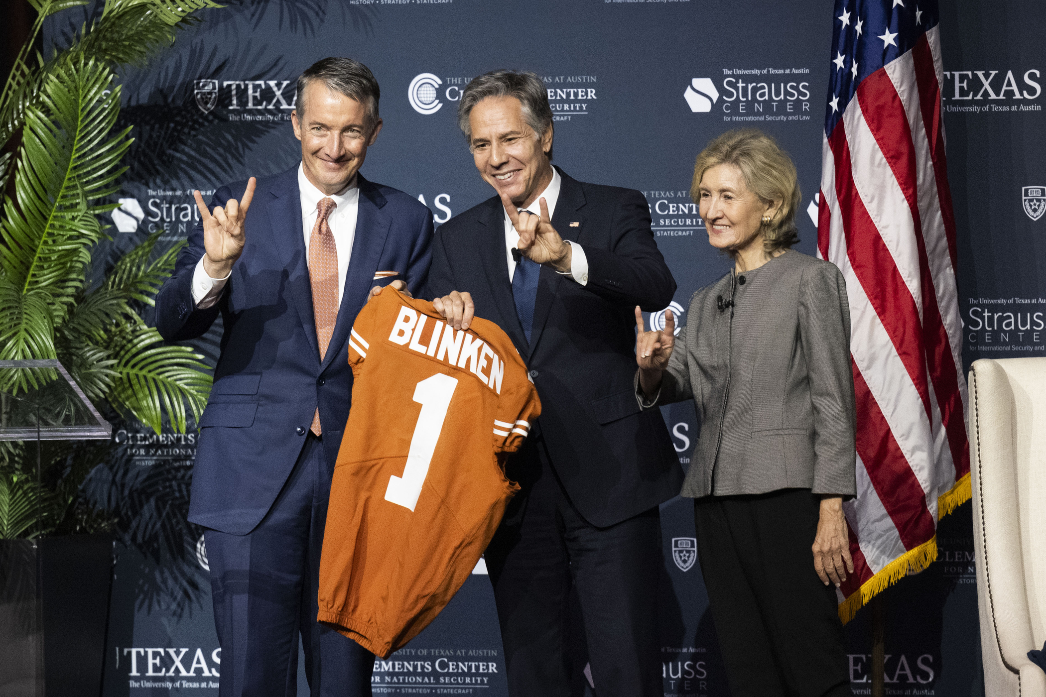 President Jay Hartzell and former U.S. Senator and UT cheerleader Kay Bailey Hutchison present Secretary of State Antony Blinken with a Longhorn jersey.
