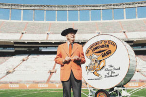 Legendary Longhorn Band director Vincent R. DiNino in front of Big Bertha
