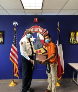 Austin Fire Chief Joel Baker (left) and Paradigm Robotics Founder and Chief Executive Officer Siddharth Thakur (right)