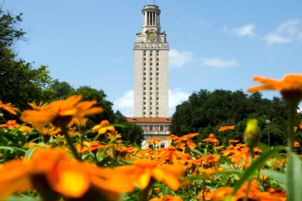 The UT Austin Tower with flowers in front of it