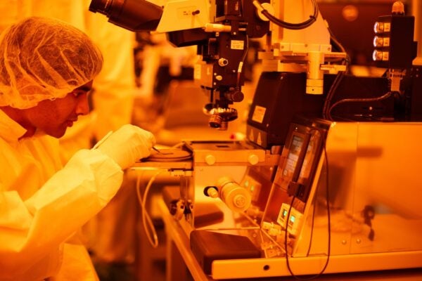 Student learning the fundamentals of semiconductor chip fabrication.