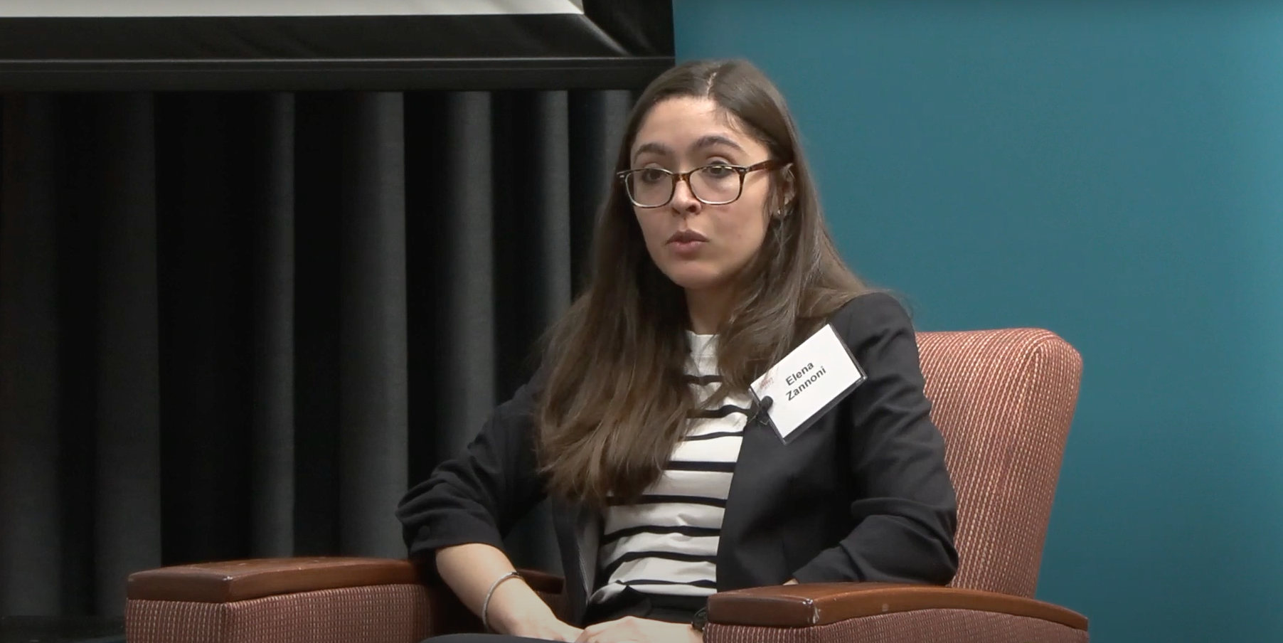 woman in a chair speaking