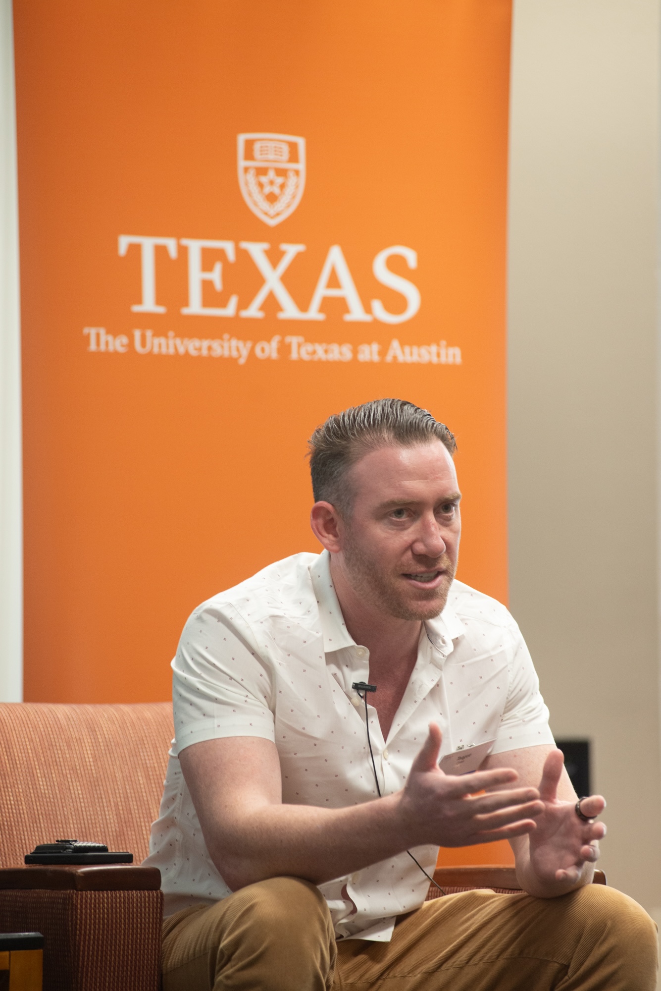 man in chair speaking