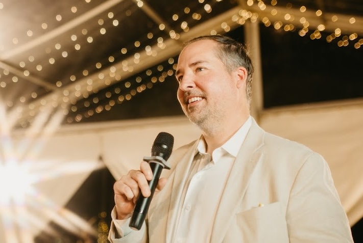 Man with microphone at an event