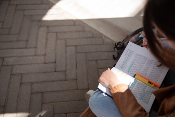 Overhead photo of student reading book