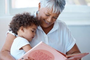 Older adult reading to a child