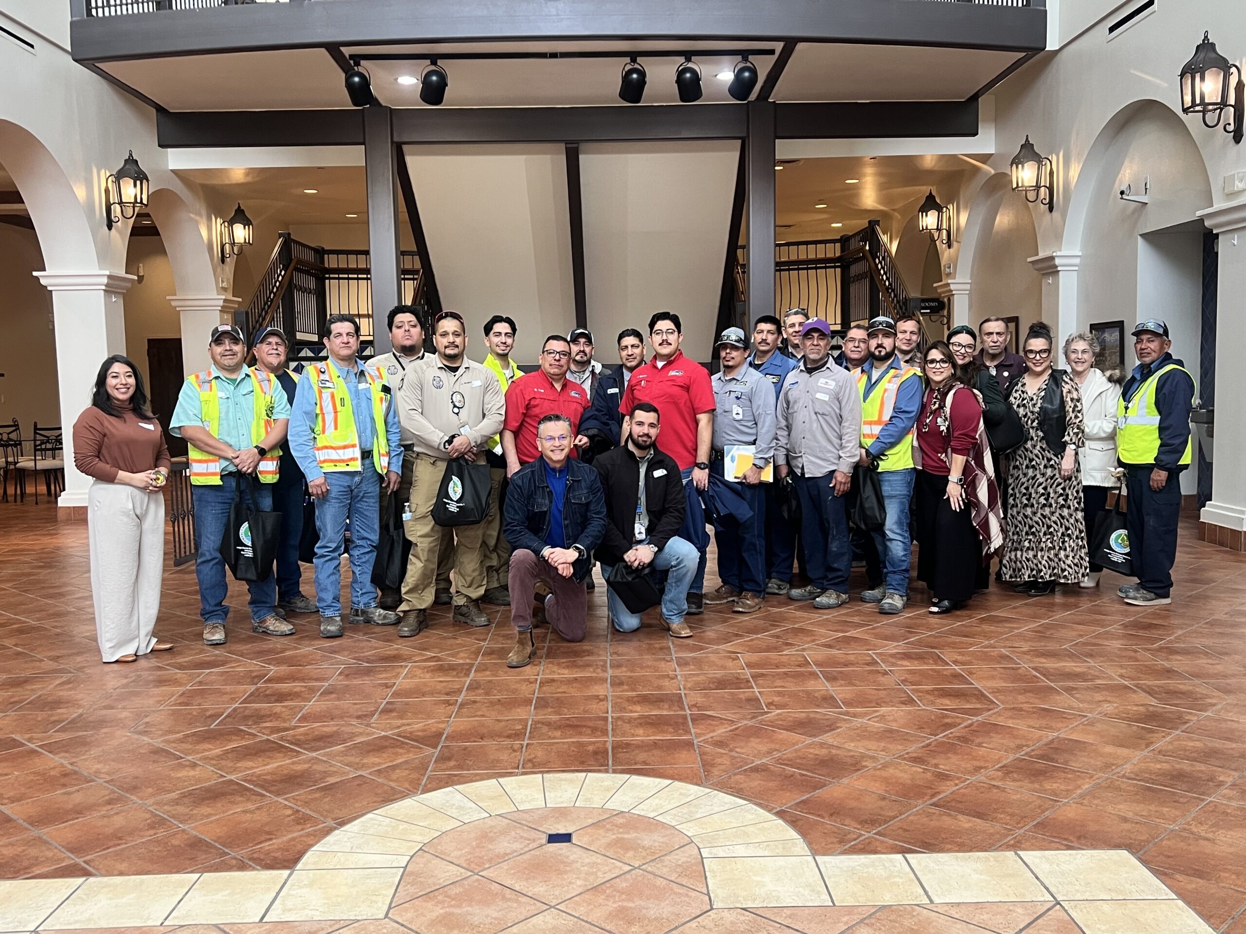 Early responders stand together posing for photo