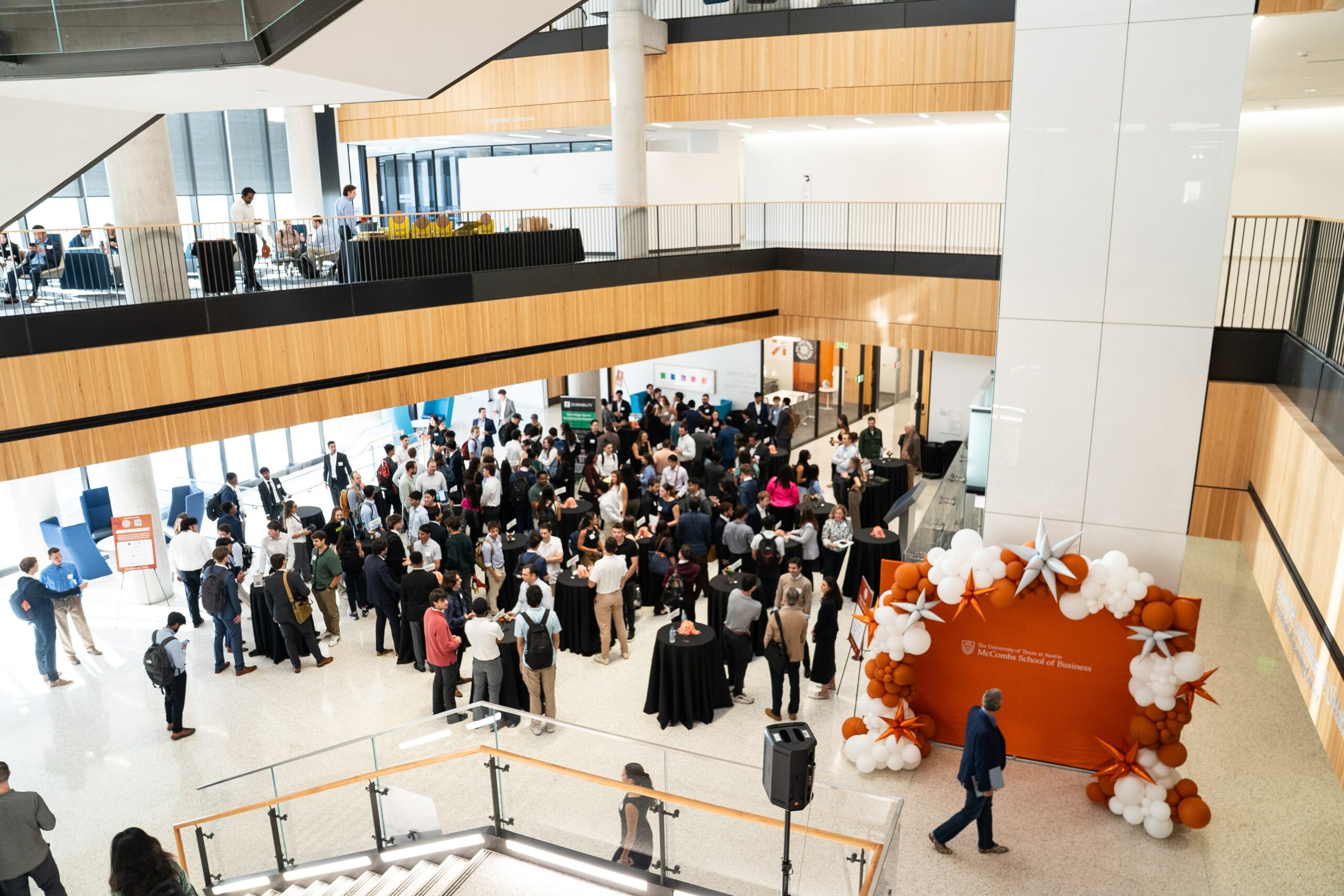 A view from above of a networking reception at an event.