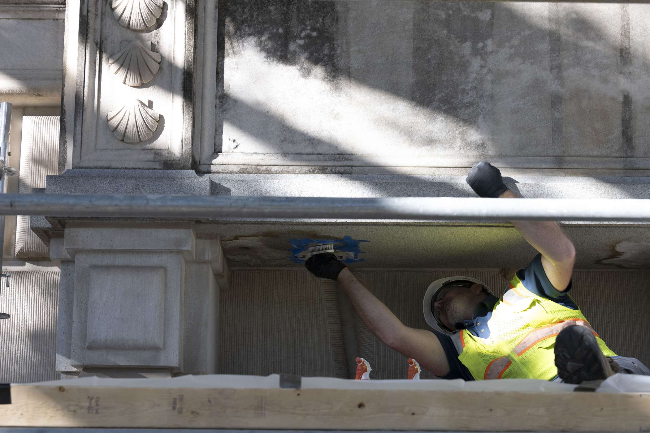 Man in hardhat and vest scuba underside