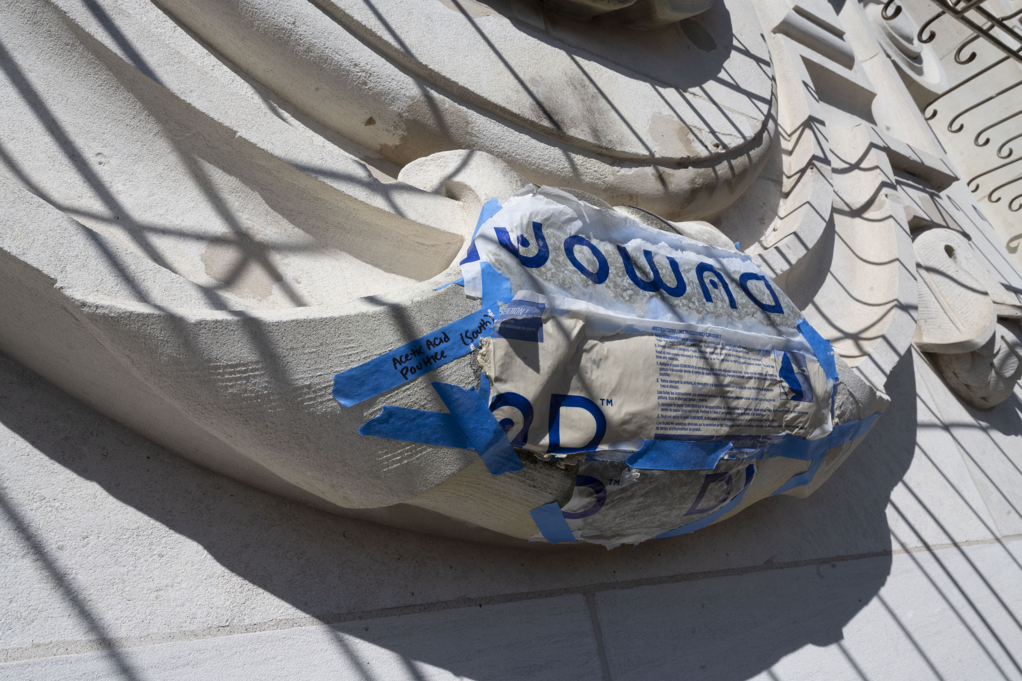 stonework taped off with plastic covering