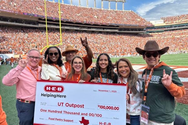 UT and HEB on field presenting gift.11.1.25