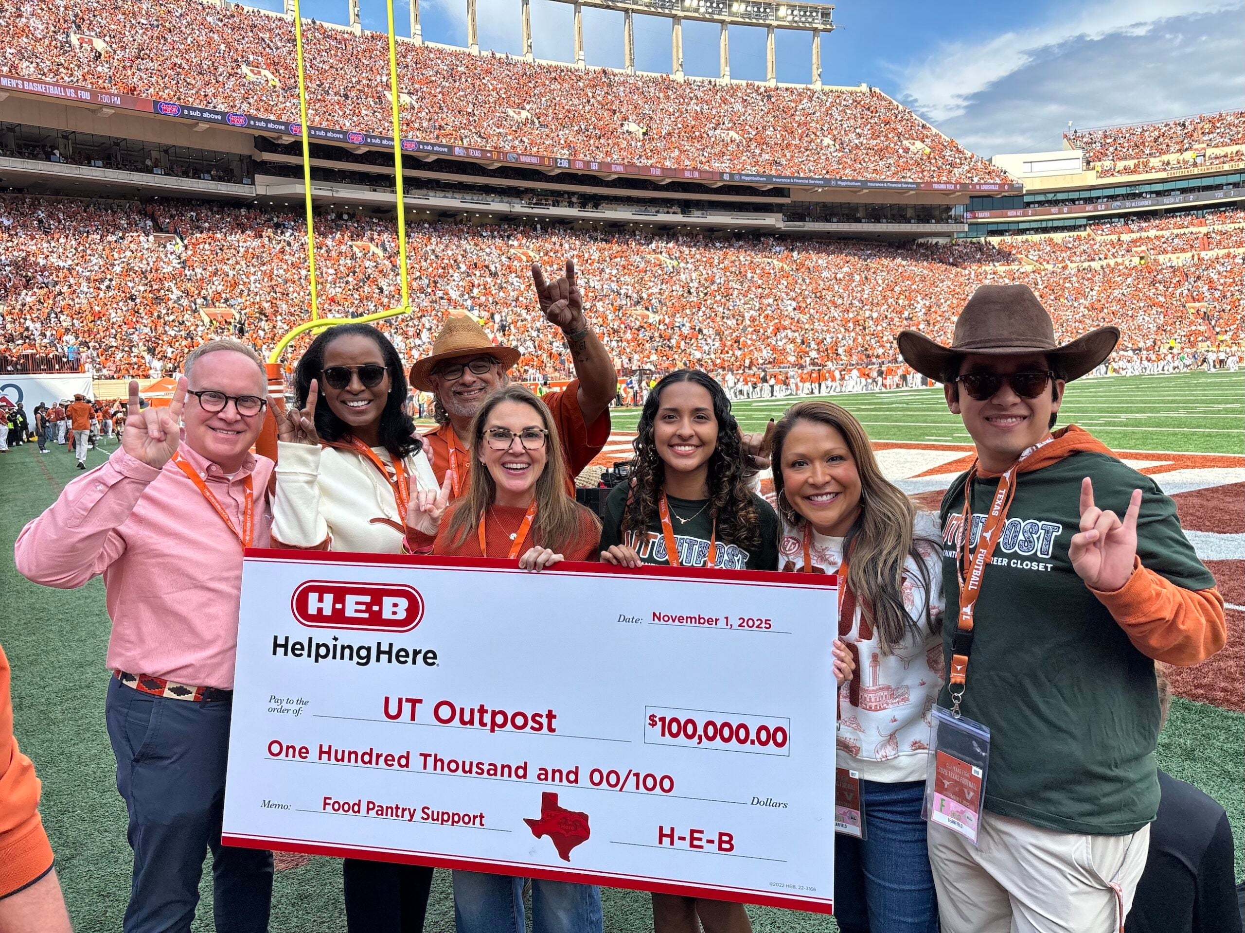 UT and HEB on field presenting gift.11.1.25