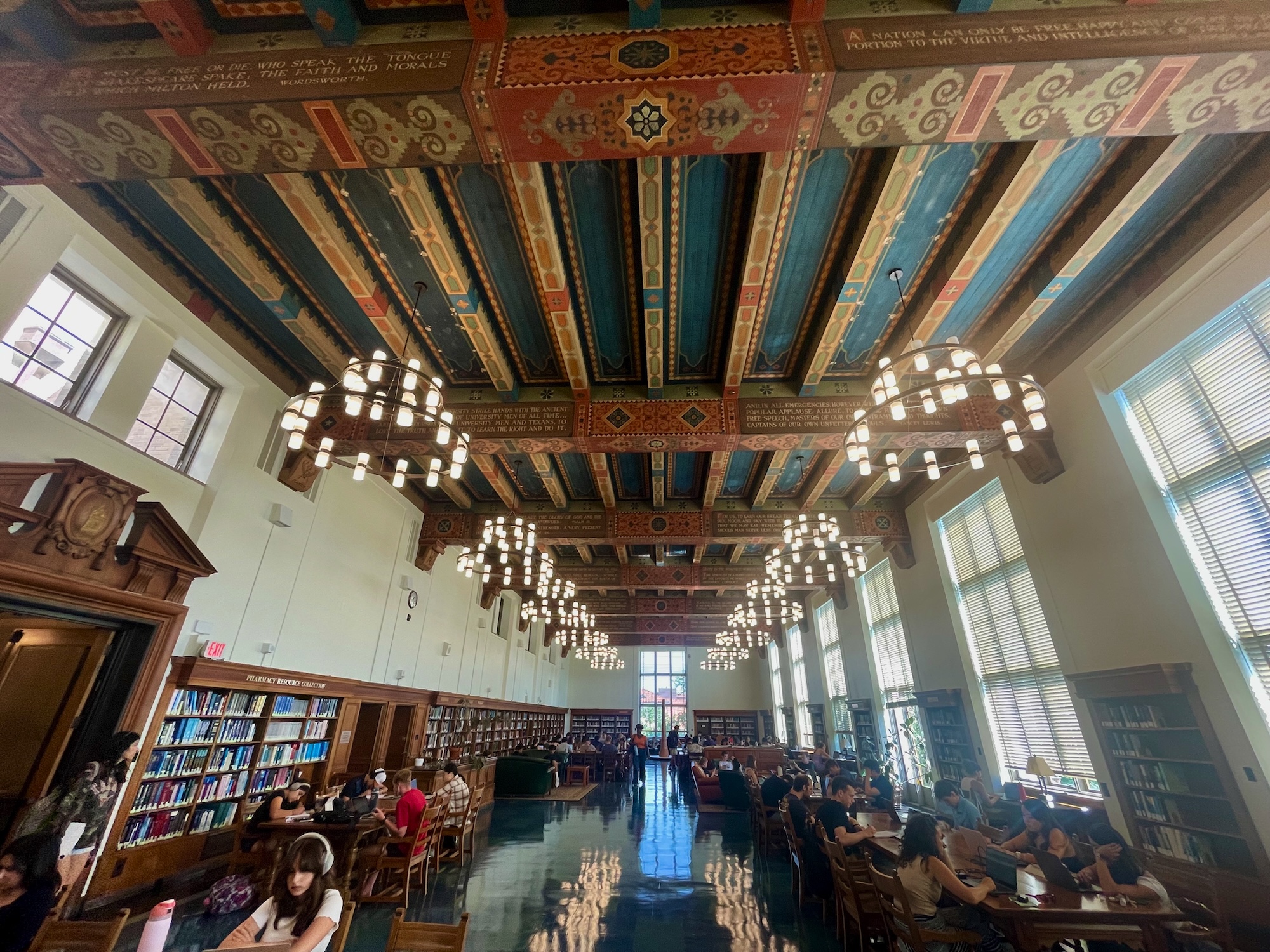 Spacious classical library reading room with ornate beans