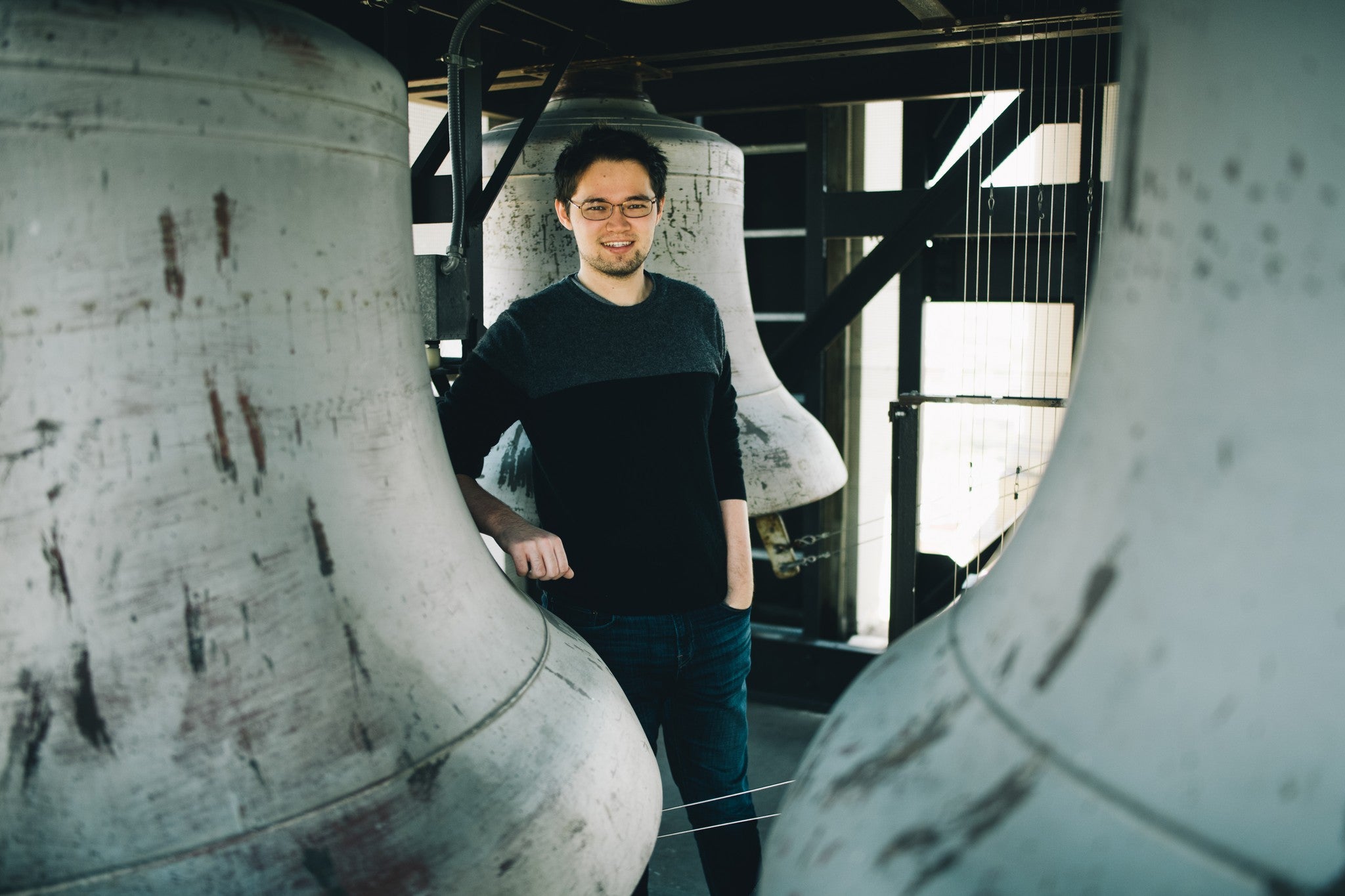 image of a student with the carillon bells in the Tower