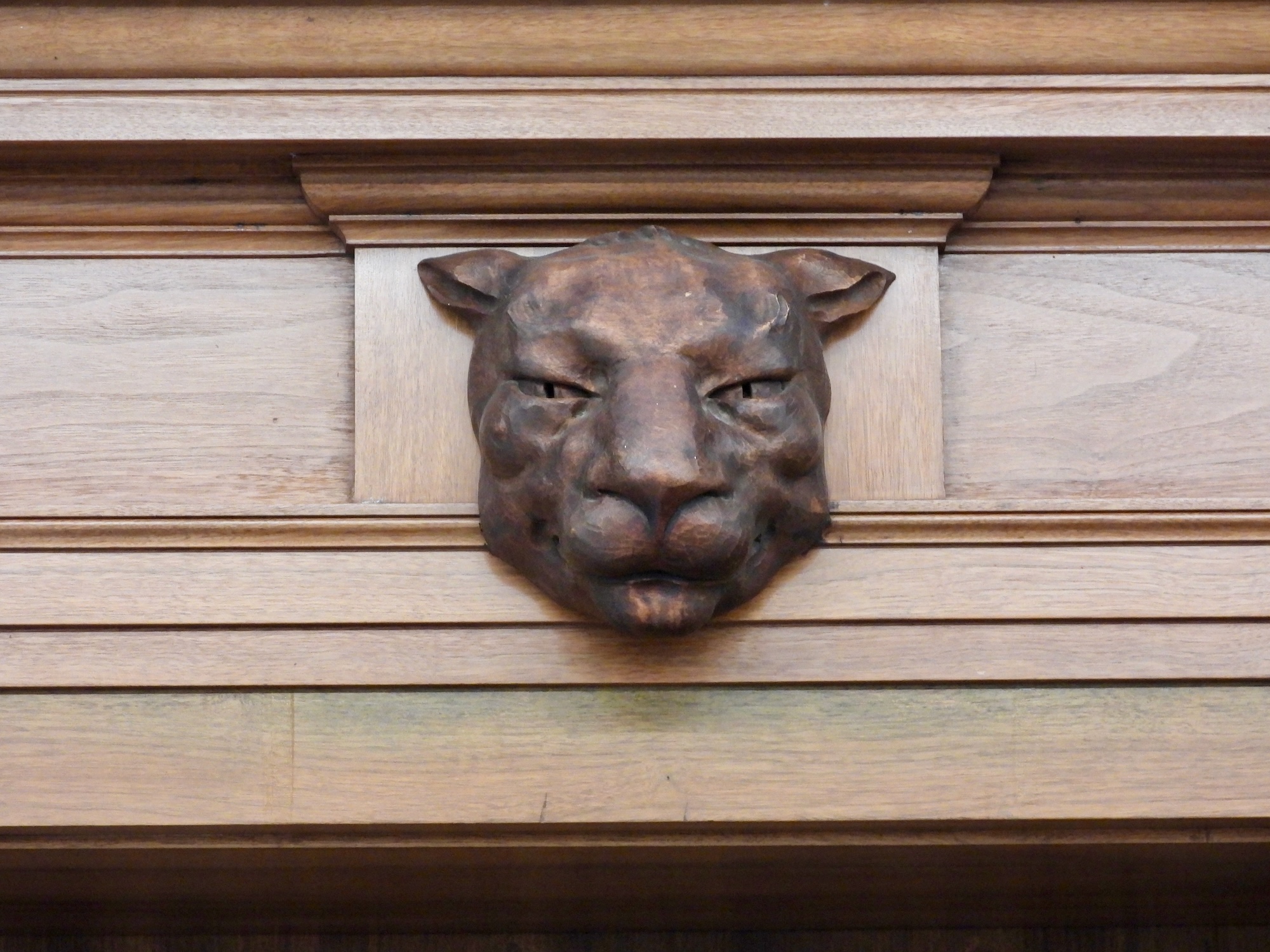 carved wooden cougar head