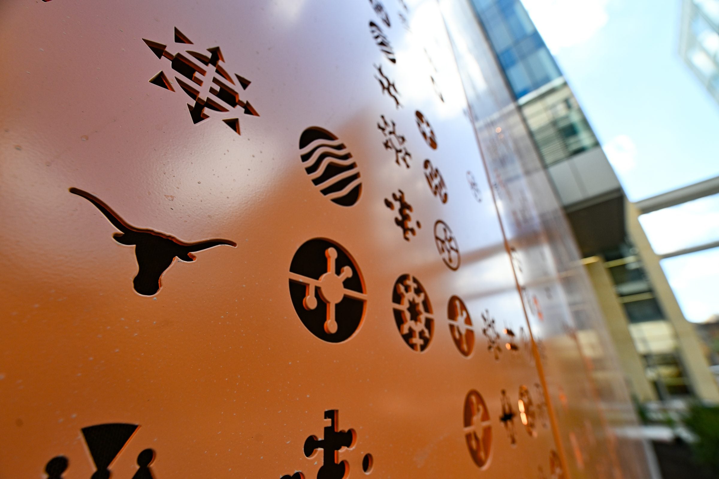 Burnt orange art installation with circle design