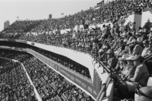 black and white image of the crowd at a footbal game at DKR