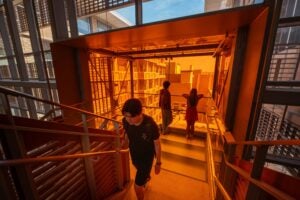 Student walks up the stairs in College of Natural Sciences building