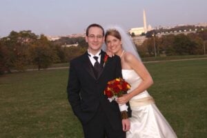 Bride and groom with field in background