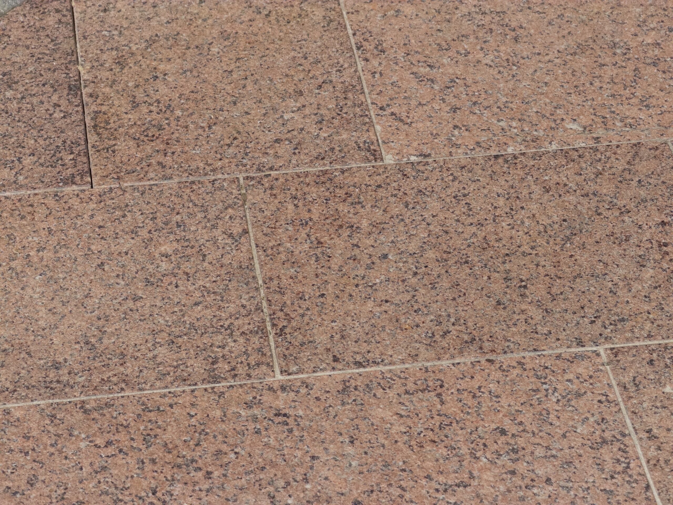 close up image of the granite on the steps of Main Building