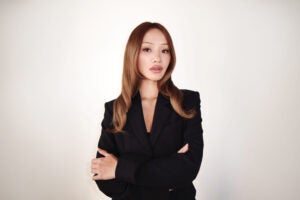 headshot of Sarah Cheung standing with her arms crossed