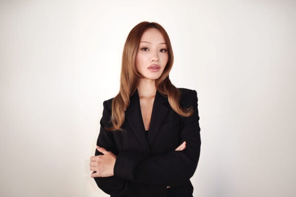 headshot of Sarah Cheung standing with her arms crossed
