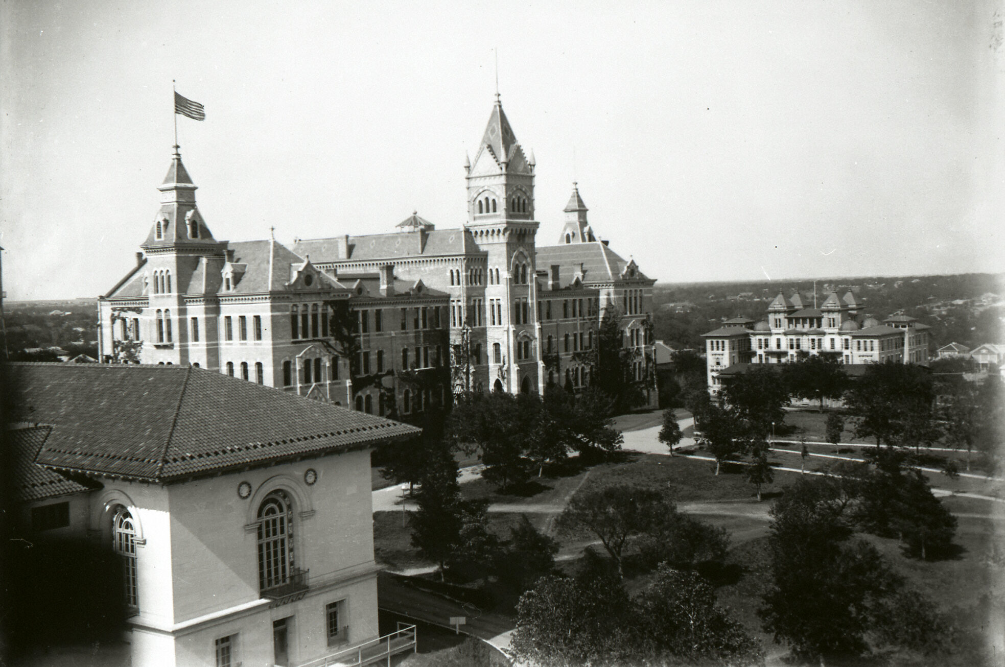 An antique image of Old Main Building at UT in black and white