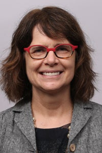 close up photo of woman with red glasses