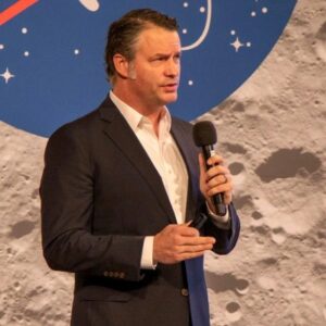 man on stage with microphone