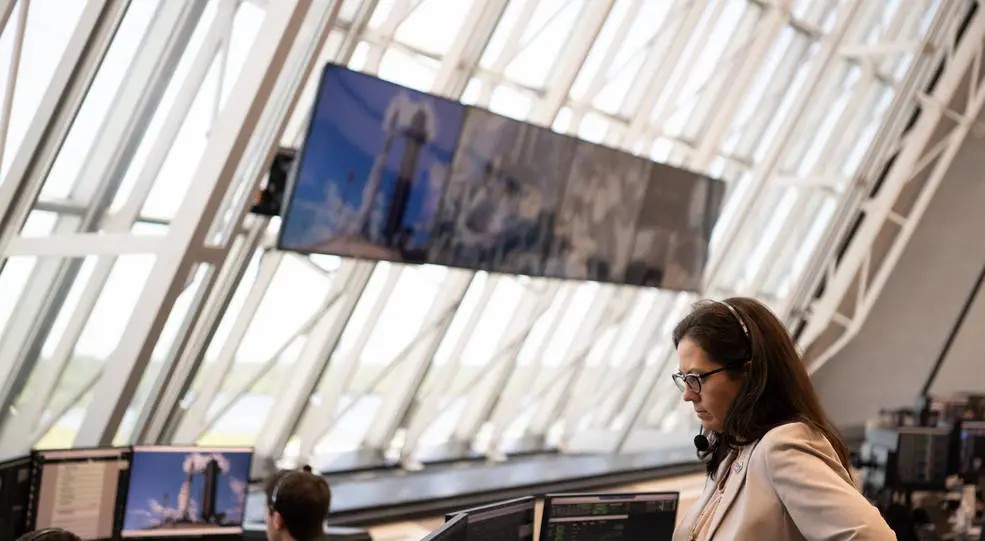 Glass windows fill image, with woman in right corner