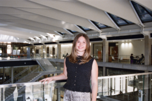 image of a woman standing on a balcony in the EER building