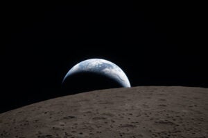 Moon in foreground, earth in background