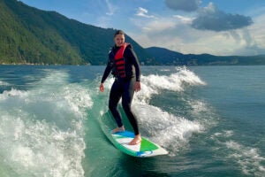 image of a woman wakesurfing on Lake Como