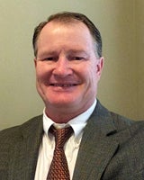 Close up photo of man wearing tie