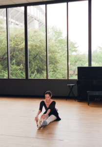 image of a ballet dancer stretching