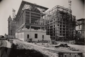 Stonework begins on the outside of the steel structure in the previous photograph