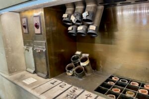 Pneumatic tube console with hand-written numbers for floors