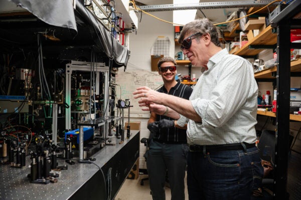 image of two scientists wearing glasses in a lab