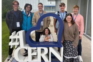image of a group of students next to a sign that says I Love CERN