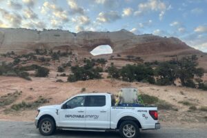 image of a truck parked along the highway in front of Arches National Park