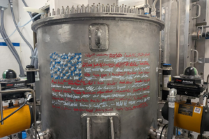 image of a nuclear reactor with signatures on it in the shape of an American flag