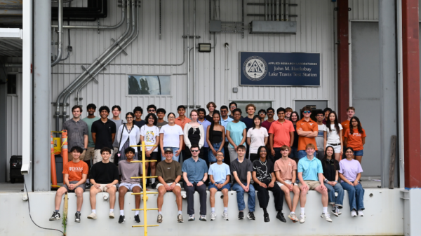 image of a group of students posing for a group photo at a lab