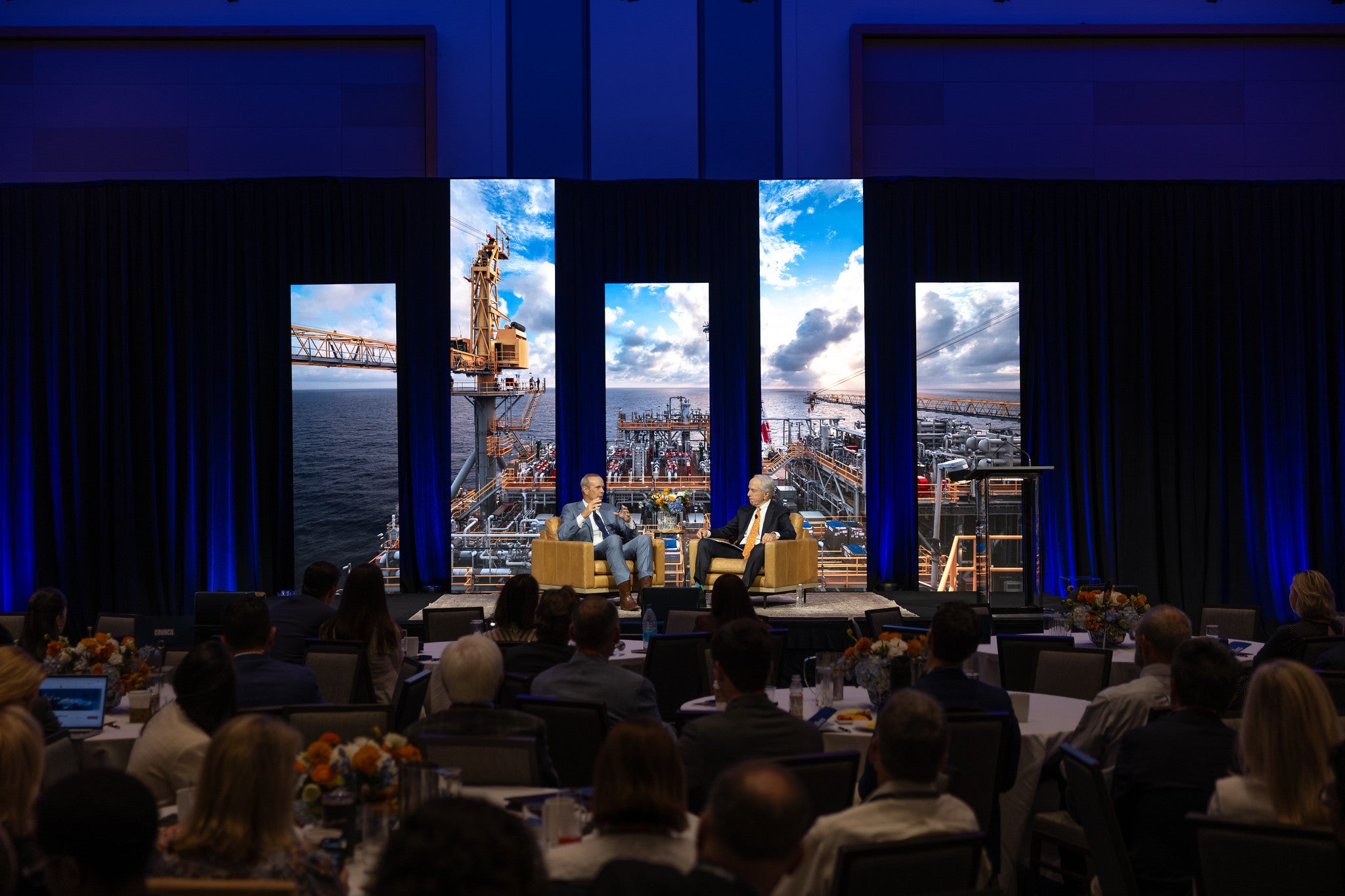 image of two men on stage at a conference