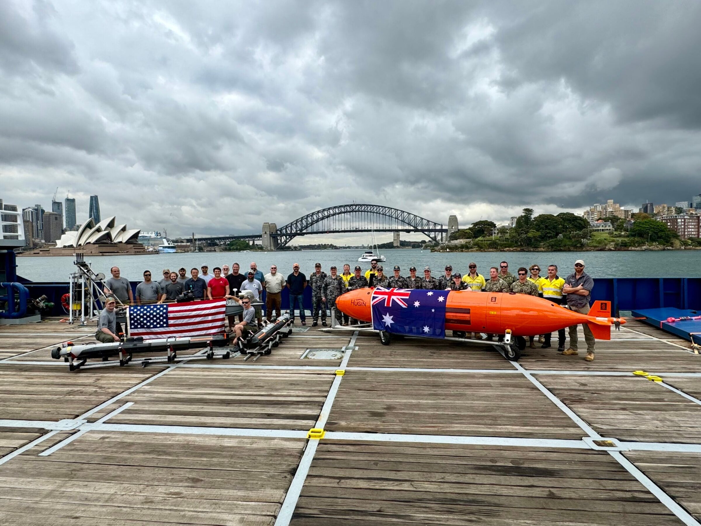 Members of the Royal Australian Navy and the U.S. Navy pose for a photo during a maritime exercise out of Sydney Harbour.