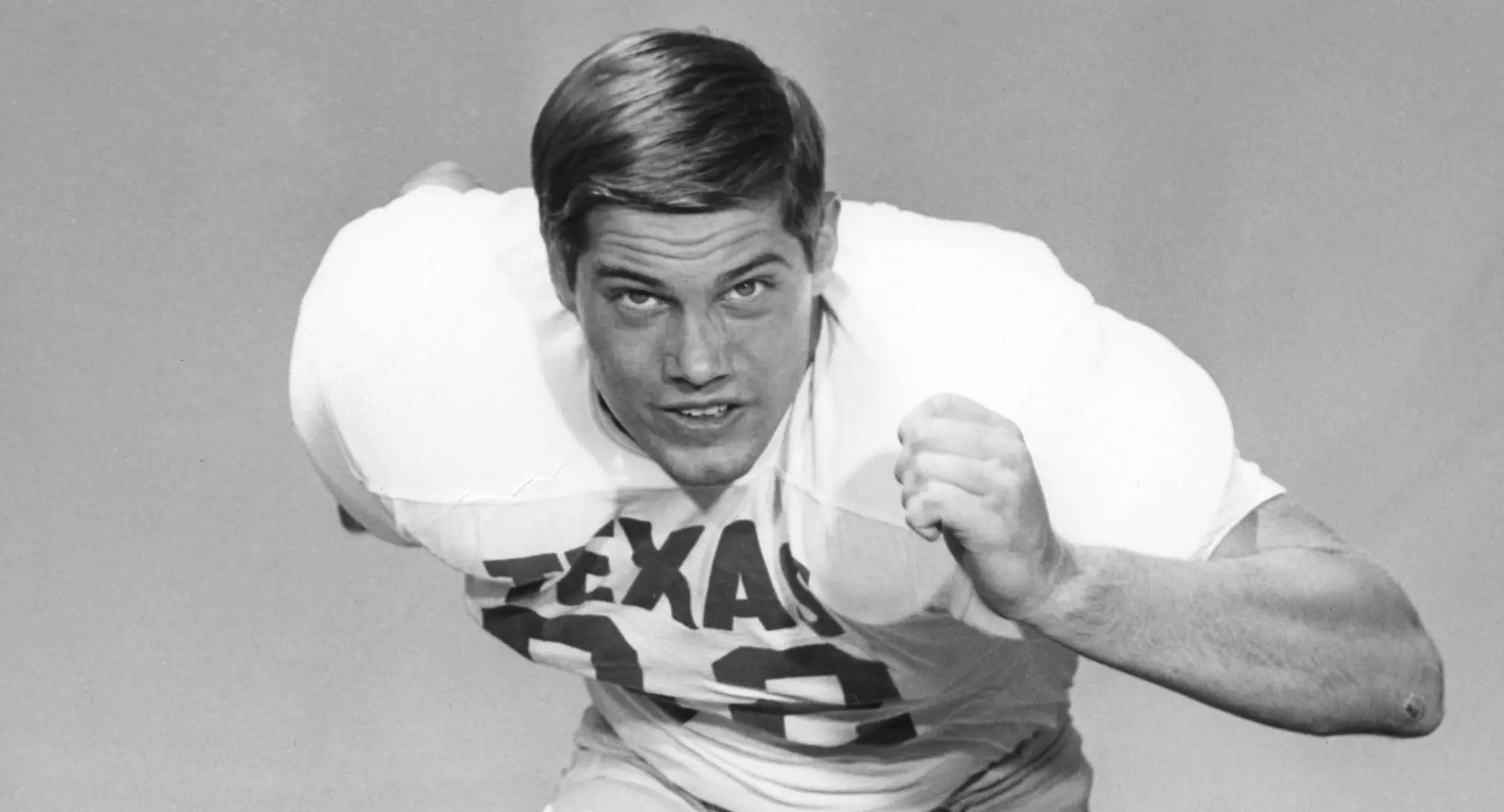black and white image of a football player