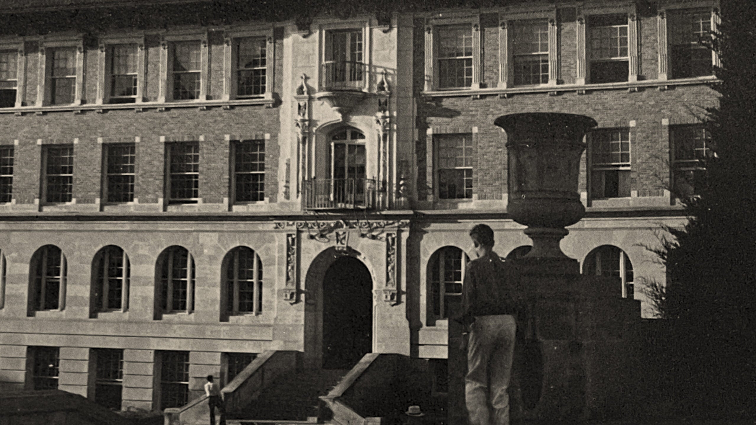 A black and white photo of Garrison Hall on the University of Texas at Austin campus.