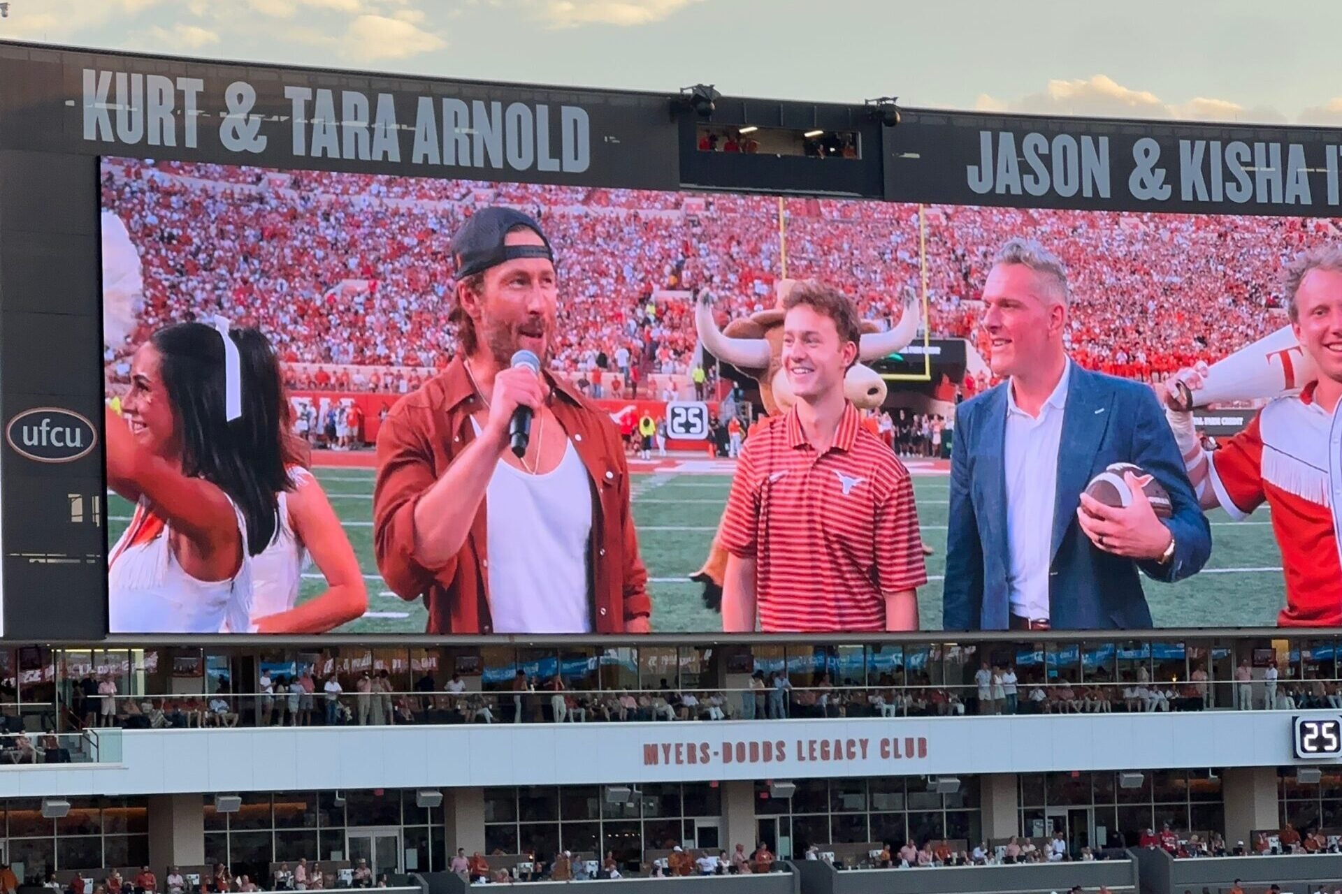 image of people on a football field screen
