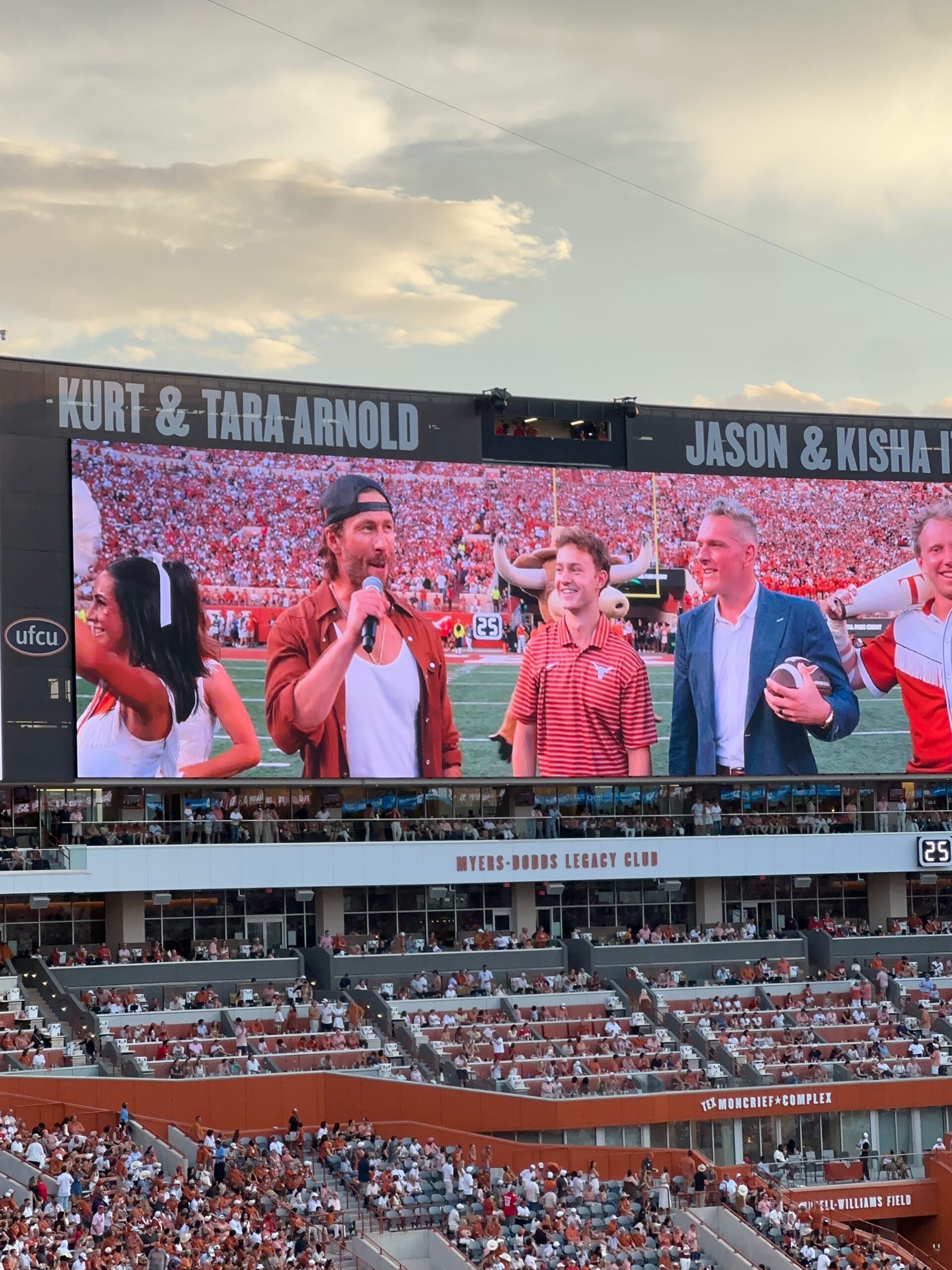 image of people on a football field screen
